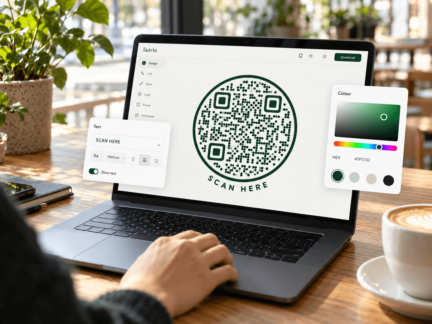 Laavia QR design editor on a laptop, with green code styling and colour controls